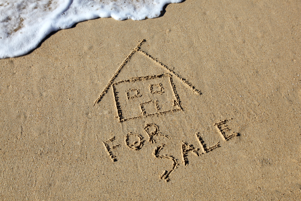 House for Sale, with beach background